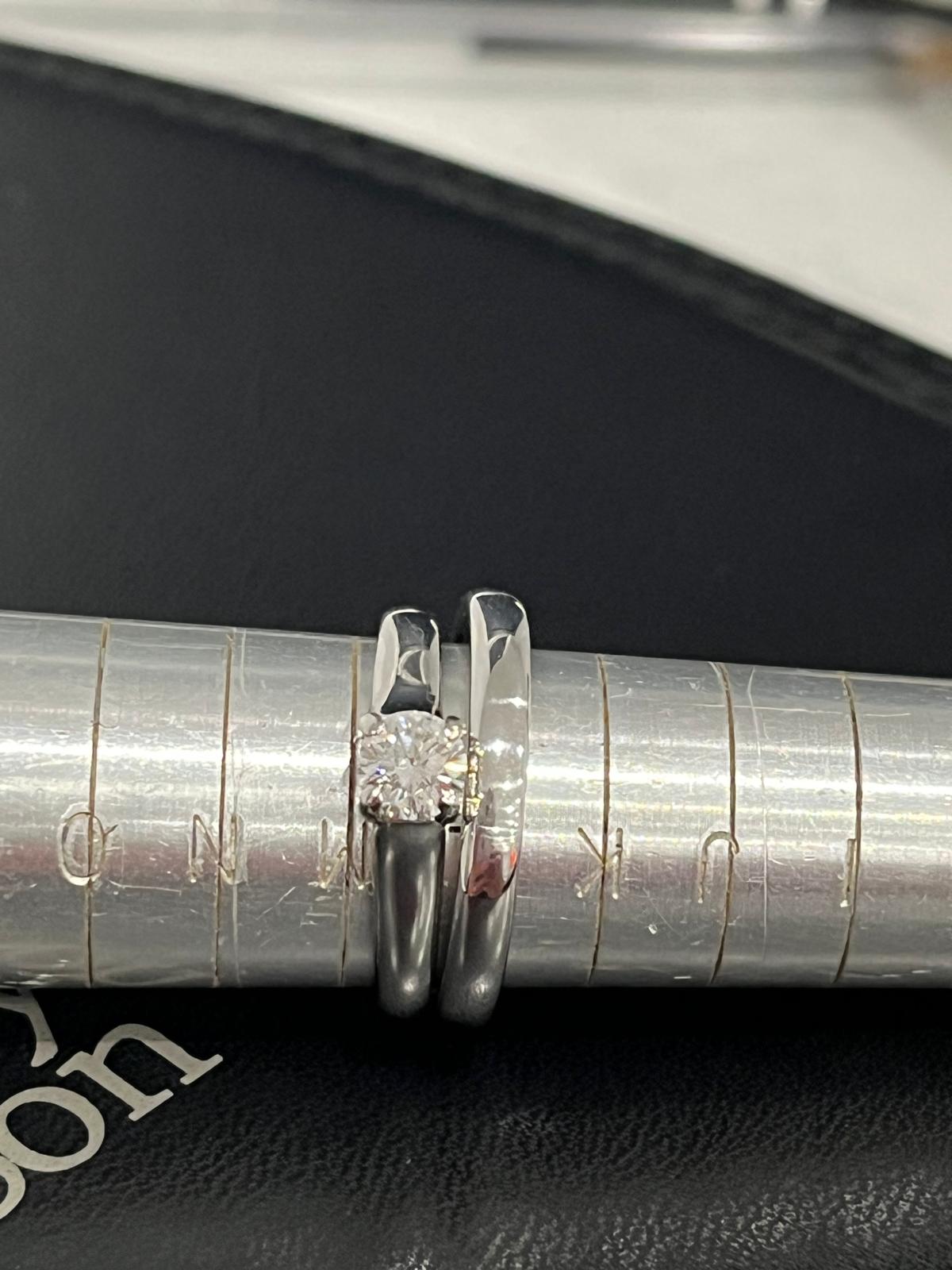 The same platinum rings after professional polishing, with a bright finish.