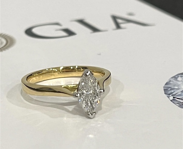 GIA-graded mined marquise cut diamond engagement ring with platinum head and 18ct yellow-gold shank