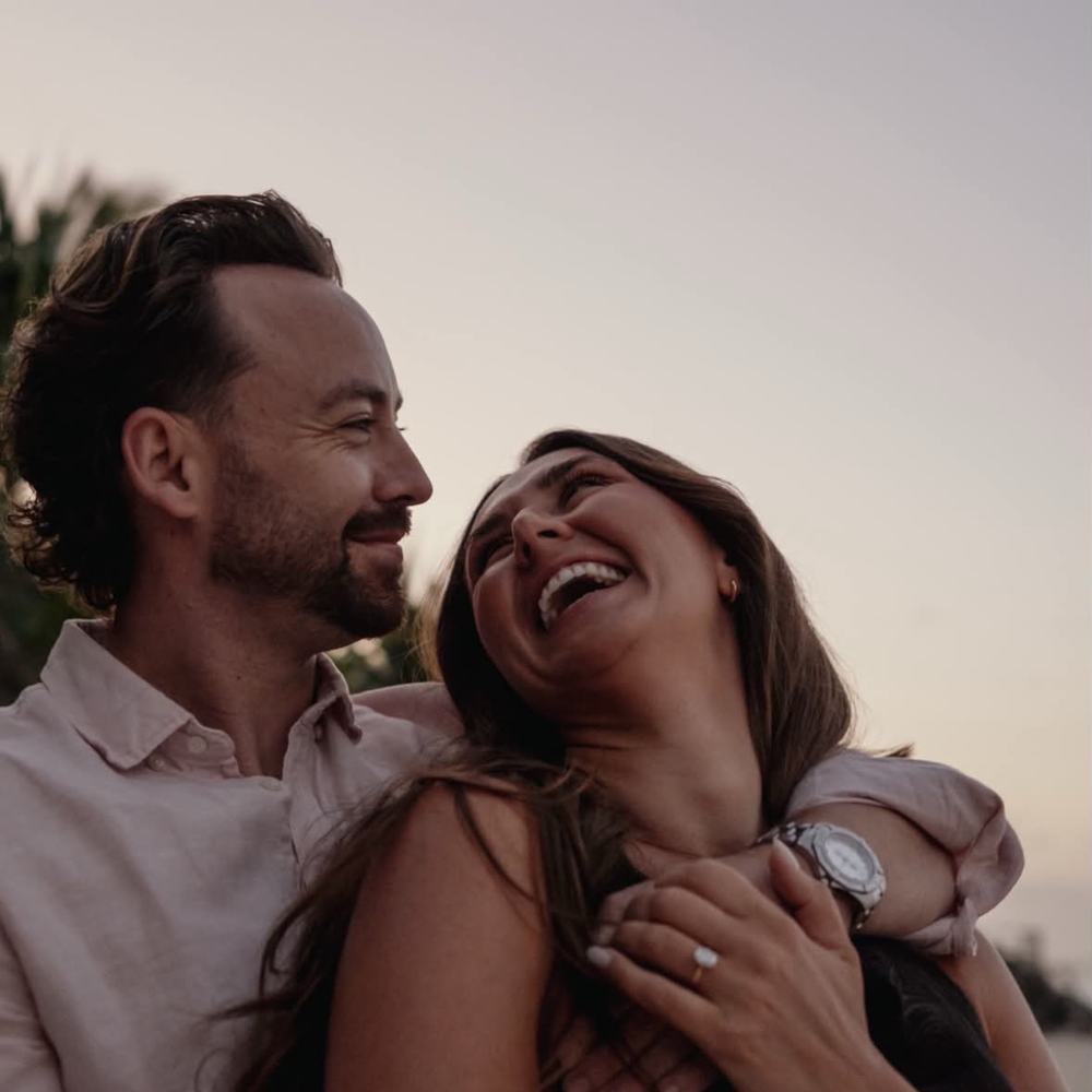Sophie and Jordan laughing together after the proposal