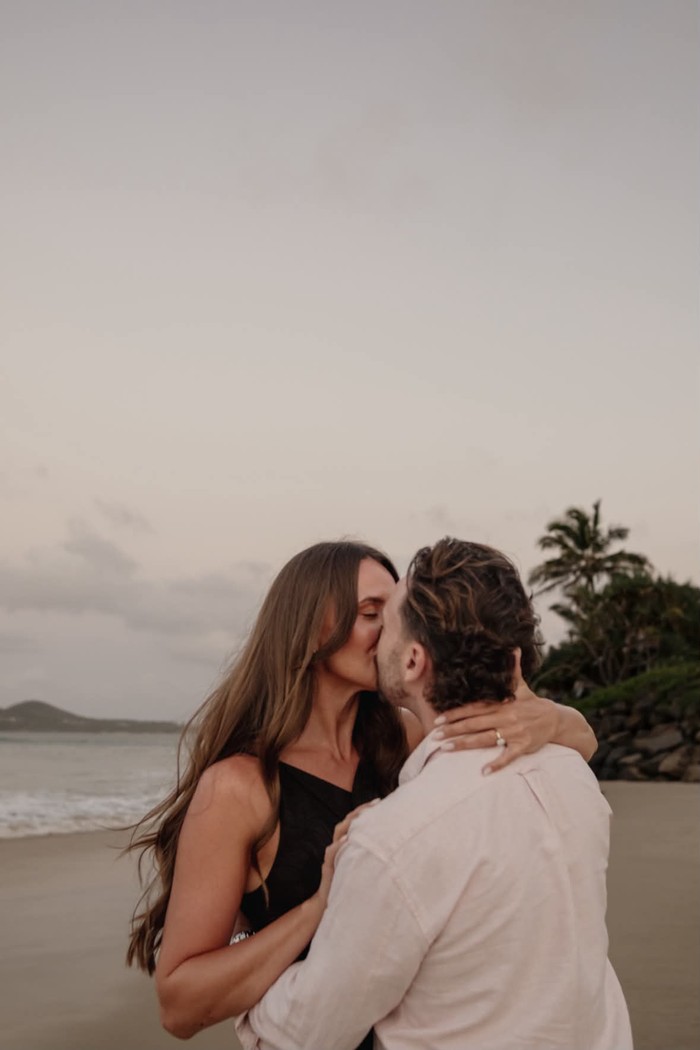 Sophie and Jordan by the sea during their engagement story