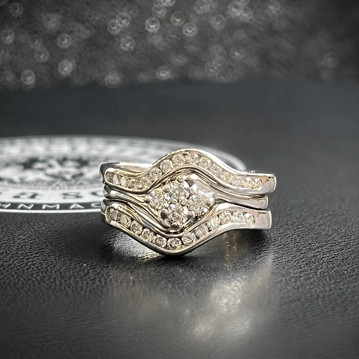 Three-ring diamond set with a matching eternity ring created through CAD.