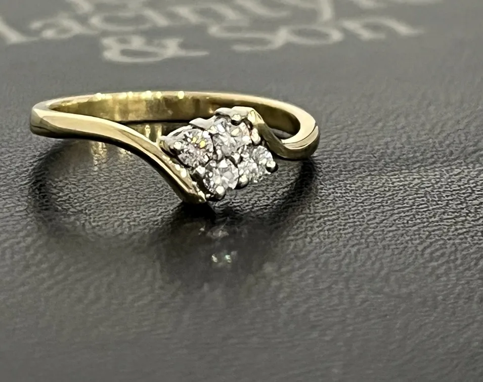 Finished ring after the missing diamond was replaced and essential claw work completed.