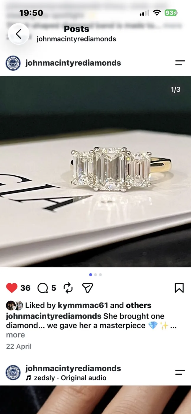 Finished emerald cut three stone ring.